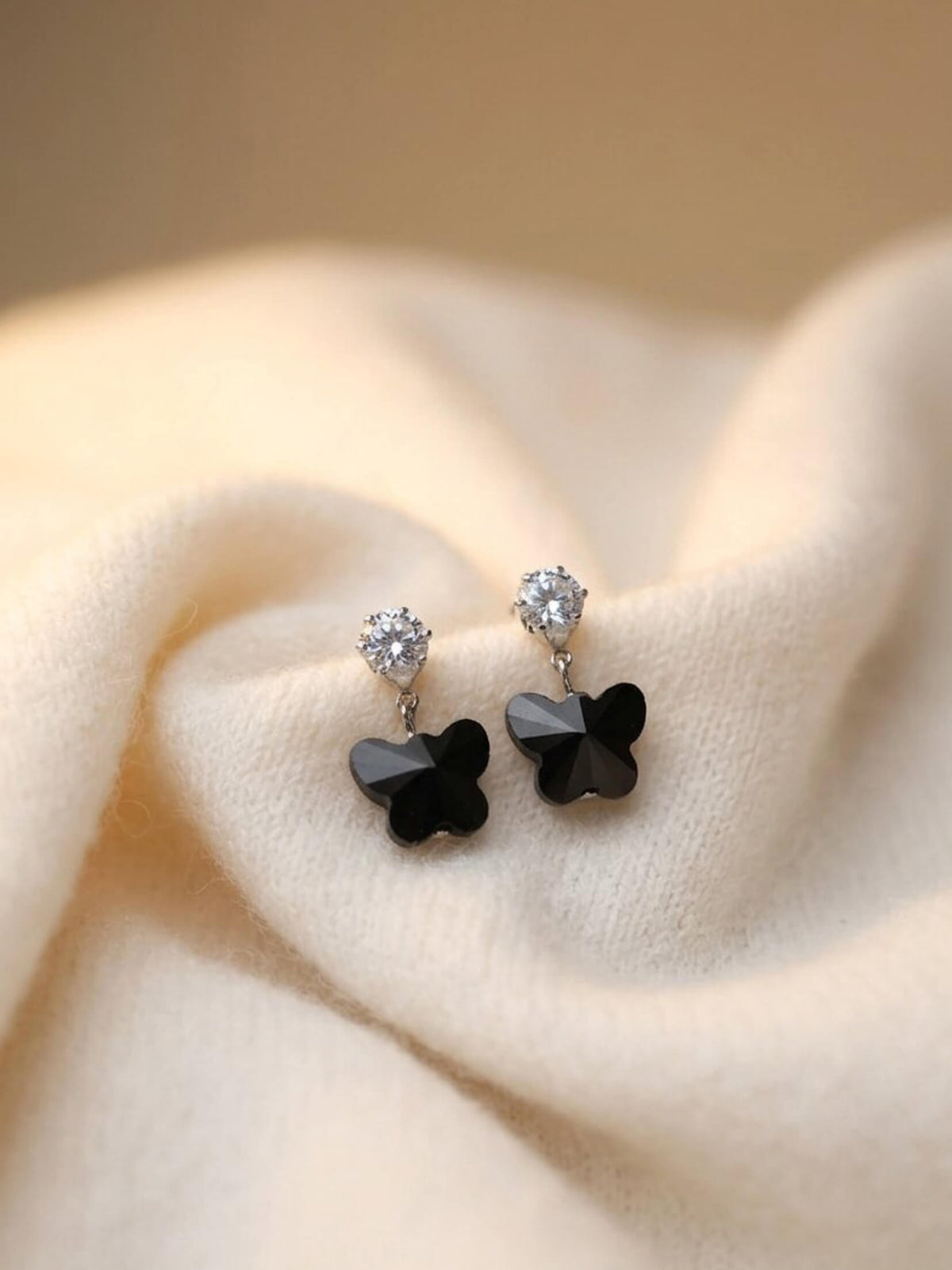 black ad butterfly earrings