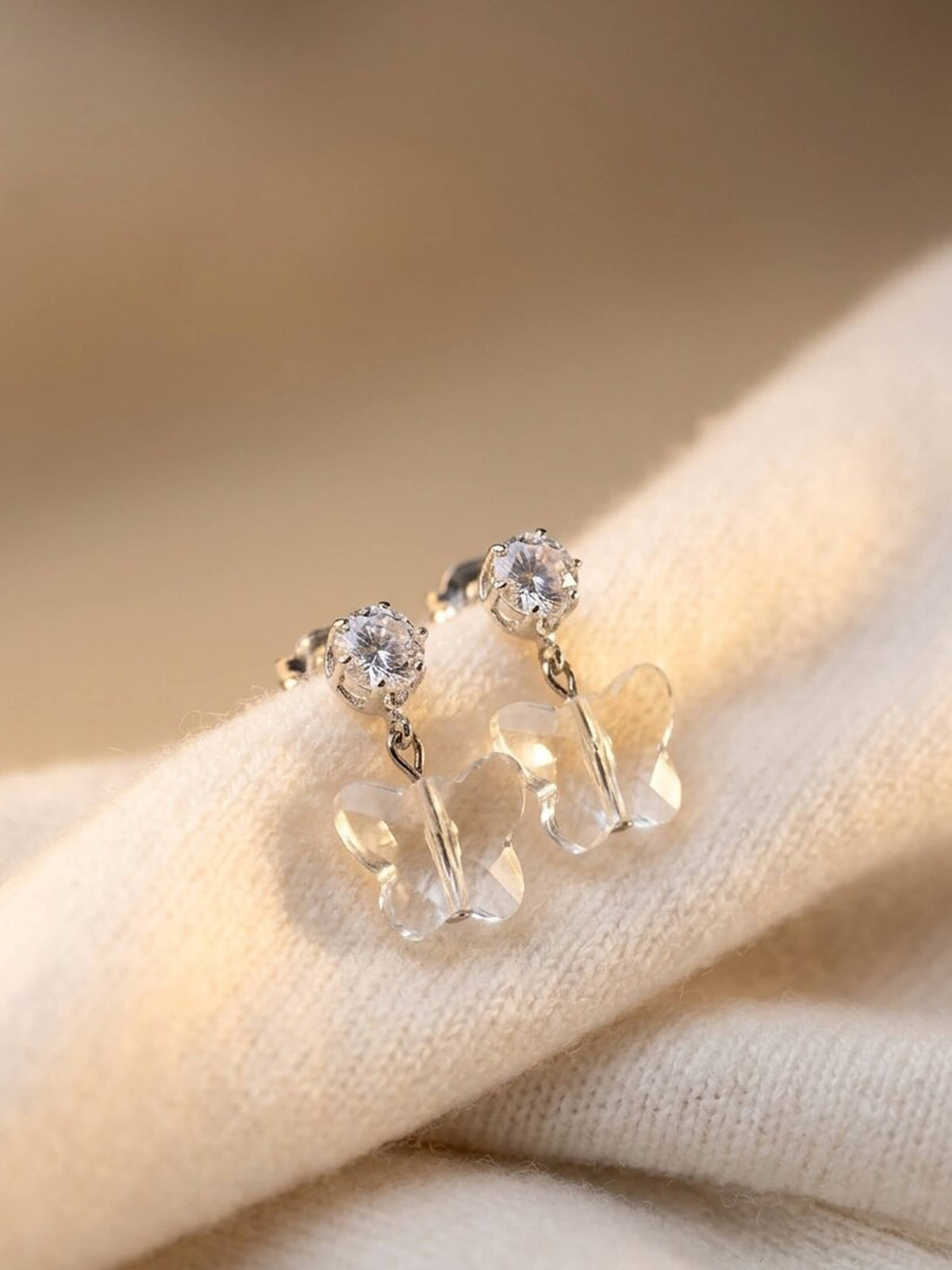 white ad butterfly earrings