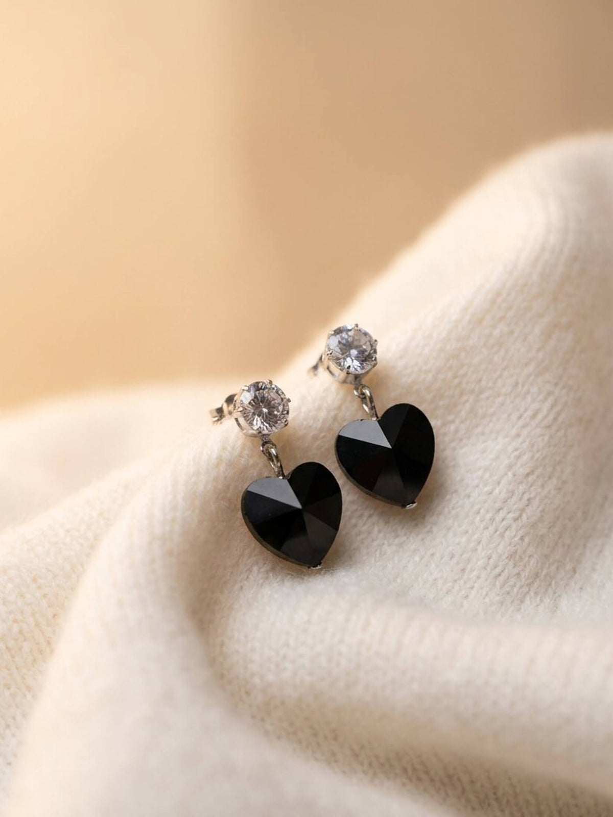 black herts ad earrings