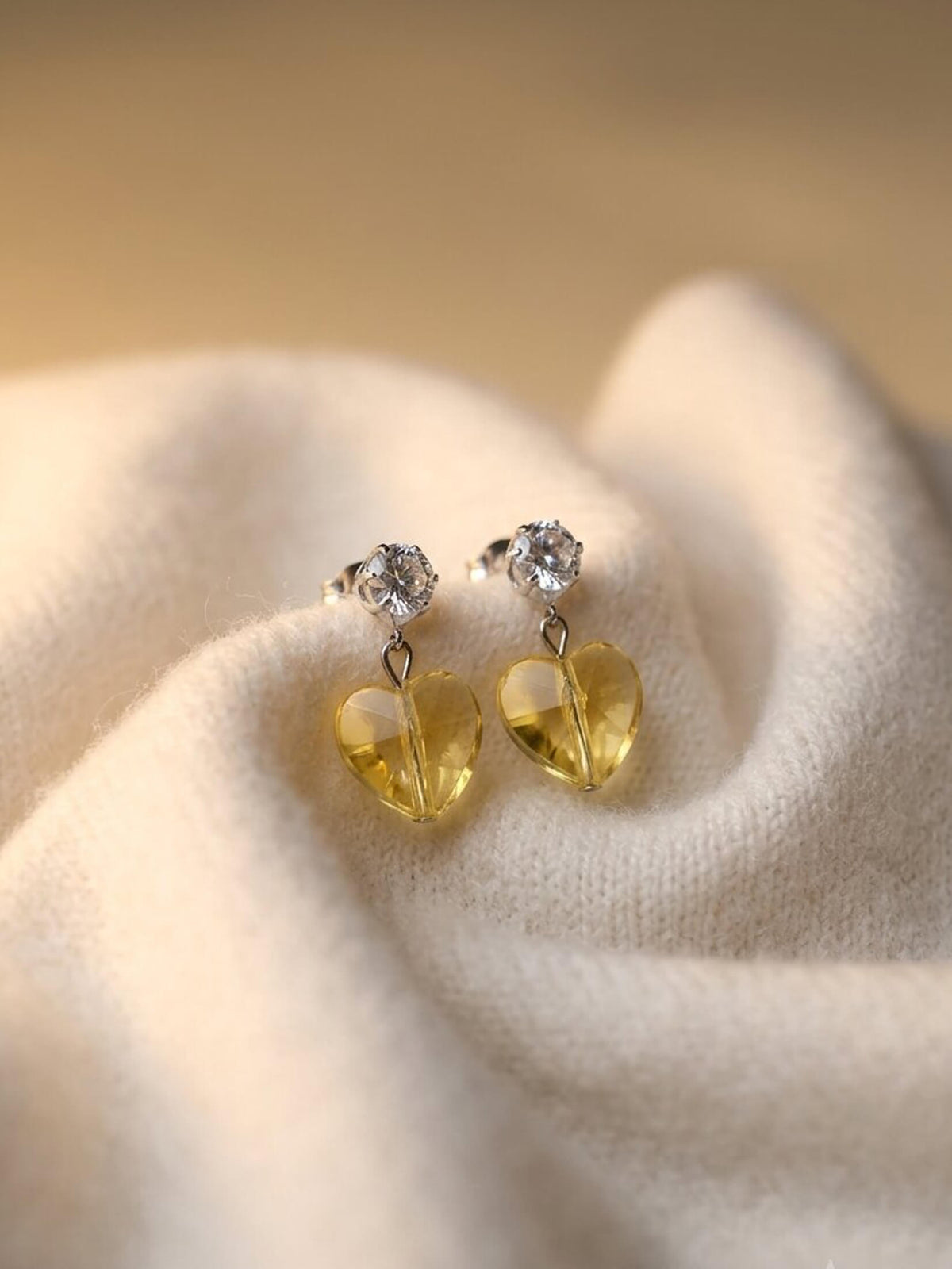 yellow herts ad earrings